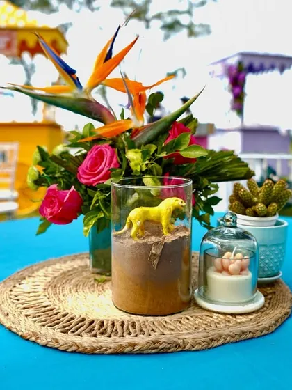It's all in the details. For this tropical Haldi in Goa, I created quirky centerpieces with vibrant florals, animal figures, and jute accents to perfectly match the fun, beachy theme.