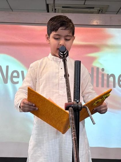 A student recites a patriotic piece during our Republic Day assembly. We celebrate this national day with great pride, reminding our students of our country's values and history.
