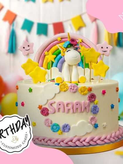 A delightful unicorn cake decorated with stars, clouds, and a rainbow. The personalized name and colorful details make it a truly special and magical birthday treat.