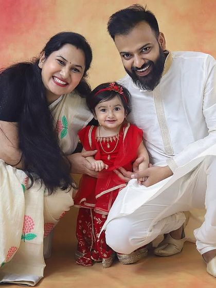 A beautiful family dressed in traditional attire for a Janmashtami themed photoshoot. The little girl dressed as Radha with her parents looks absolutely lovely.
