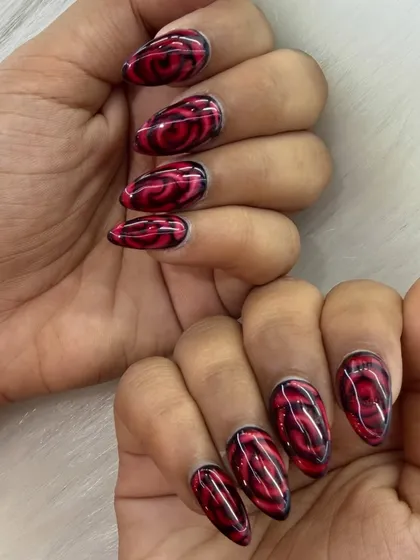 A bold and passionate design featuring a deep red rose pattern. This look shows how detailed art can transform your nails into a canvas.