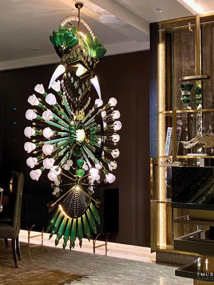 Lighting is sculpture. This magnificent, custom-fabricated chandelier serves as the artistic centerpiece of a dining area. Crafted from dozens of individual glass and metal elements, it is a testament to our ability to create unique, non-replicable decor pieces.