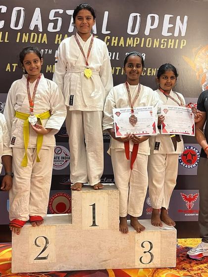 Standing with my students on the podium at the Coastal Open All India Karate Championship. A proud coach moment.