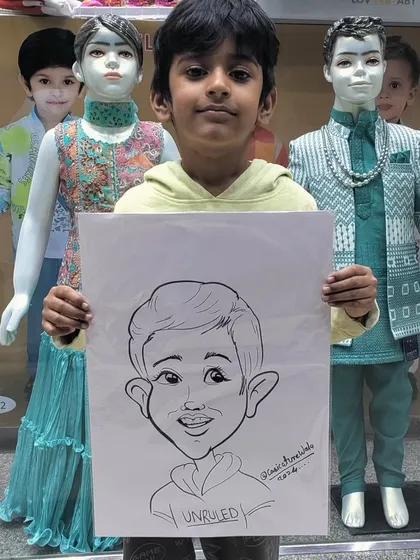 This young man is posing with his caricature in front of a clothing store, showing that I can set up my easel almost anywhere to draw.