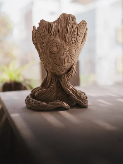 I am Groot. I had so much fun hand-building and sculpting this Groot planter. It’s amazing how you can bring characters to life with clay, and he makes a perfect home for a small plant.