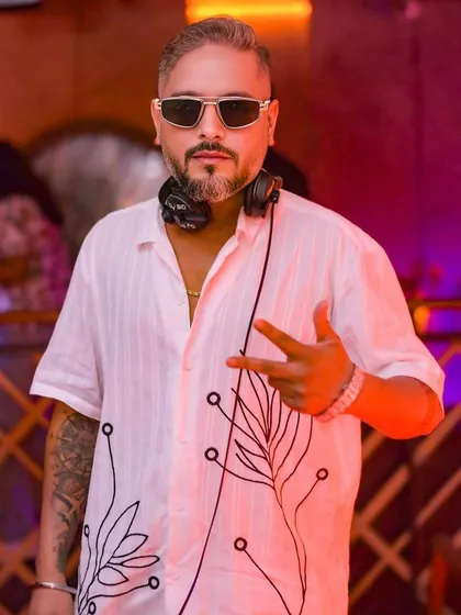 Headphones on, ready to set the mood. It's not just about the party, it's about the professional craft of curating a seamless musical journey for the entire night.