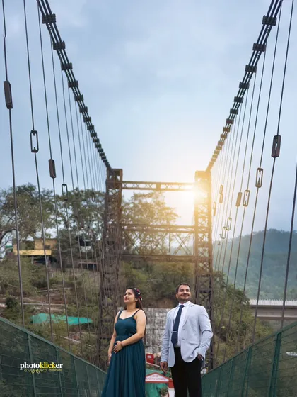 A powerful shot of a couple on a suspension bridge, symbolizing their journey together. We love finding unique locations like this for memorable pre-wedding photography.