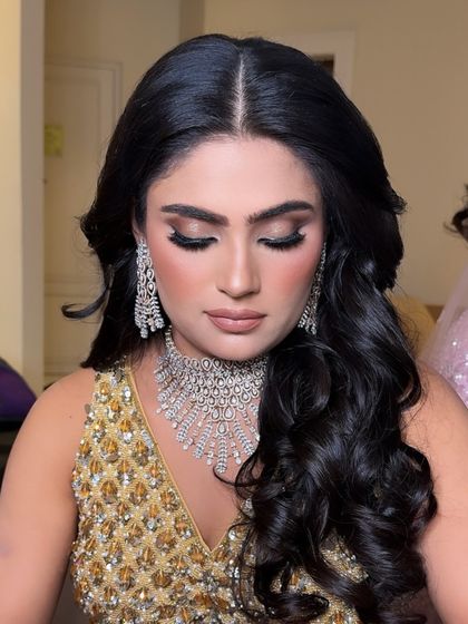 The finished eye look. A beautifully blended smokey eye with defined lashes and brows, paired with soft blush and a nude lip, creates a balanced and stunning party glam.