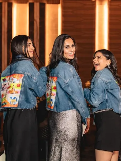 The bride's squad rocking their custom denim jackets.