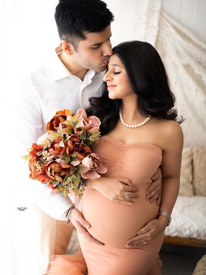 A sweet forehead kiss is a timeless expression of love. This shot is so tender, set against our pretty boho backdrop.