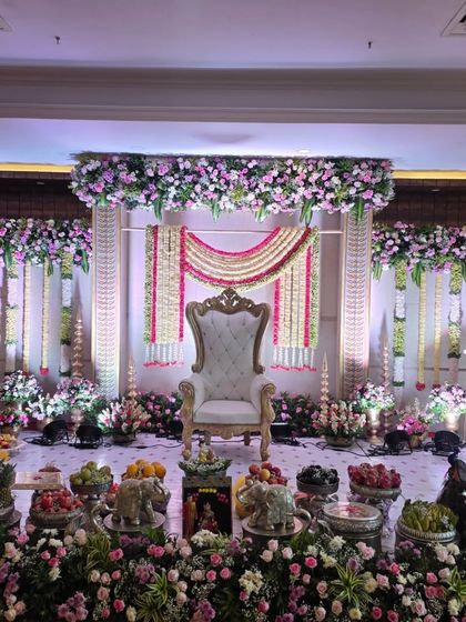 A straight-on view of the pink and white stage, emphasizing the symmetry and traditional elegance of the design.