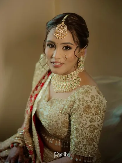 A smiling portrait of the bride, looking confident and serene.