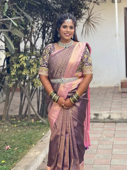 A full-length view of Gagana's beautiful ensemble. The sparkling CZ jewellery adds a touch of glamour to her traditional silk saree.