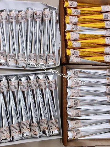 Boxes of my organic mehendi cones ready for shipping. I offer discounts on bulk orders for other artists or for large events, with both silver and gold wrapping available.