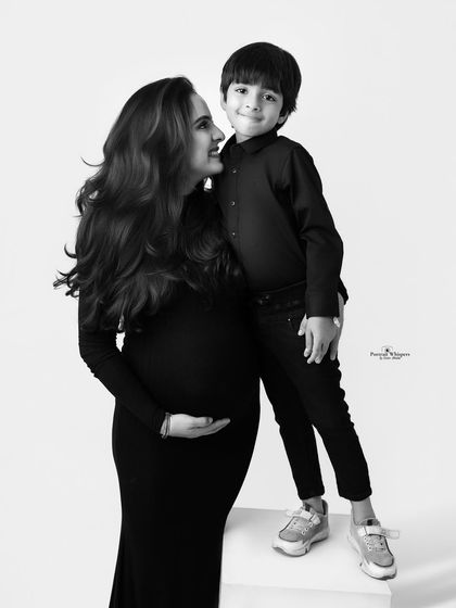 A sweet black and white portrait of a mother and her son. The way they look at each other is full of love and a special bond.