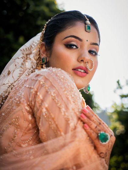 Another beautiful portrait of the model. The makeup is simple yet stunning, enhancing her natural glow.