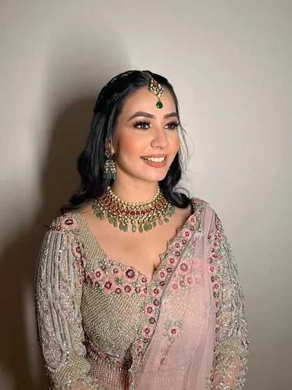 A story told through makeup. Amanpreet's look for her ceremony was soft, romantic, and utterly timeless, matching her pastel pink lehenga.