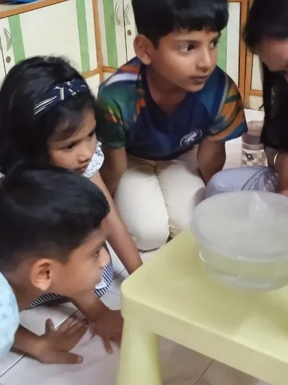 Even my youngest scientists, the 'Science Juniors' aged 4-7, get to explore big ideas. Here, a group is captivated as they watch the water cycle happen right before their eyes, learning about evaporation and condensation in a simple, hands-on way.