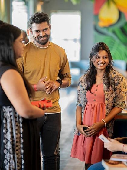 The audience mingling and chatting after a book reading, showing the networking and community-building aspect of our events.