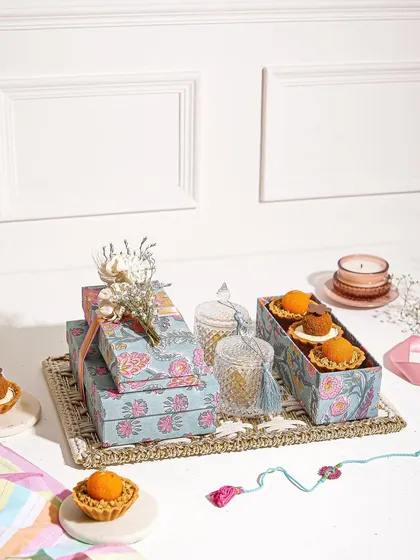 A full view of our Rakhi celebration spread, featuring our Mithai Tartlets and beautifully designed gift boxes.