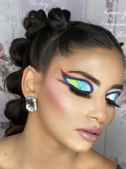 Another angle of the colorful graphic eye makeup, showing the shimmer and dimension of the eyeshadows.