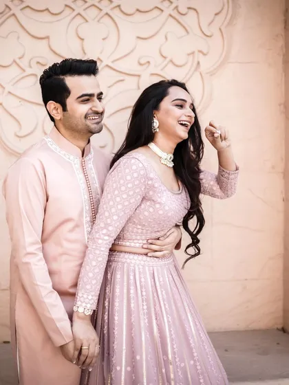 A candid laugh captured during a pre-wedding shoot. These unposed moments often make for the most cherished memories and photos.