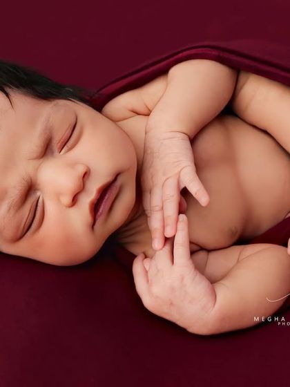 The 'potato sack' wrap is a safe and comfortable way to pose newborns, keeping them snug and sleepy for their portrait.