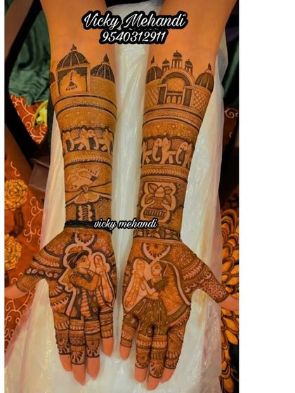 A beautiful portrayal of a couple's varmala ceremony, with elephants and palace architecture on the arms to create a truly royal feel.