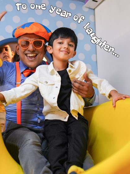 To one year of laughter. This photo with a Blippi entertainer captures the pure joy and excitement that fills our play arena every day.