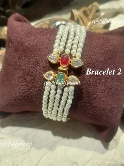 This is the second bracelet option from the versatile Navratna set. This part features a simple string of pearls with a small, colorful clasp, perfect for a minimalist look.