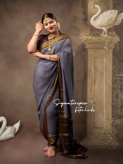 A full-length view of the grey saree portrait, showcasing the unique draping and graceful posture.