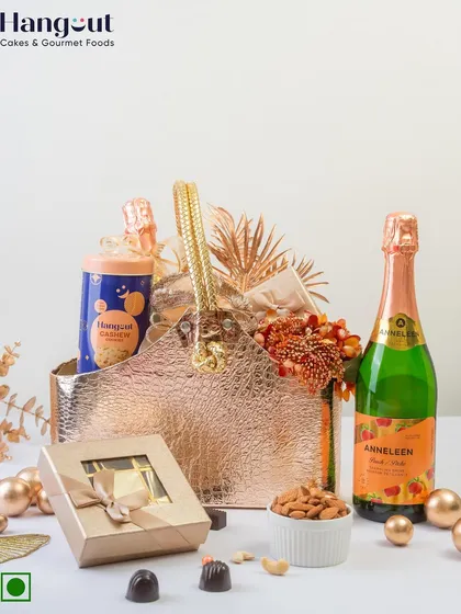 This elegant hamper is perfect as a wedding giveaway or a room hamper for your guests. It includes artisanal chocolates, butter cookies, and non-alcoholic champagne, all presented in a stylish, reusable bag.