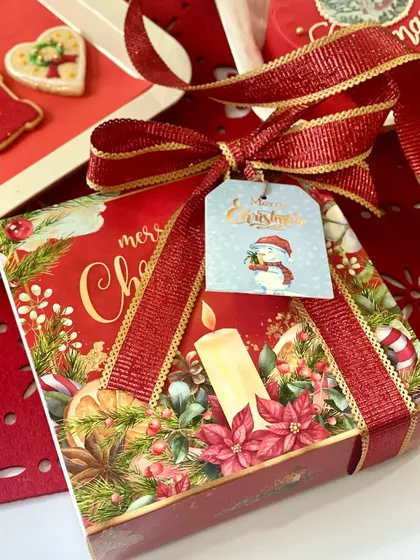 It's all in the details! We finish our Christmas gift boxes with a beautiful red and gold ribbon and a festive gift tag, so they are ready to be placed right under the tree.