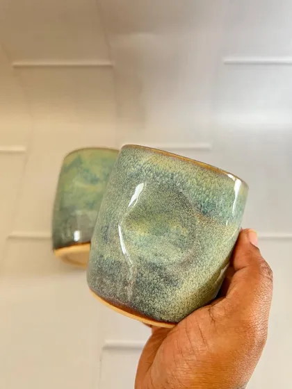 These turquoise grip mugs have a calm, serene feel. The glaze has a beautiful speckled quality that reminds me of a tranquil sea.