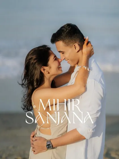A classic, romantic pre-wedding portrait on the beach at sunset. The soft light and close embrace make for a timeless and intimate photograph.