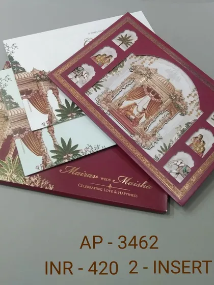 This invitation captures the heart of a traditional Indian wedding with a beautiful illustration of a bride in a doli. The rich maroon color and gold foil border make it a classic and timeless choice for your shaadi card.