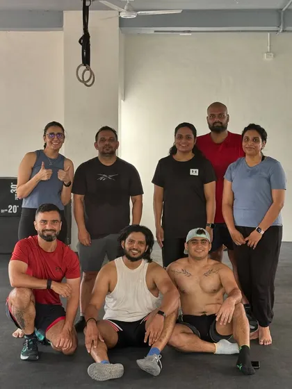 Building better humans, one day at a time. This group photo captures the positive vibes and happiness we share after a rewarding workout.