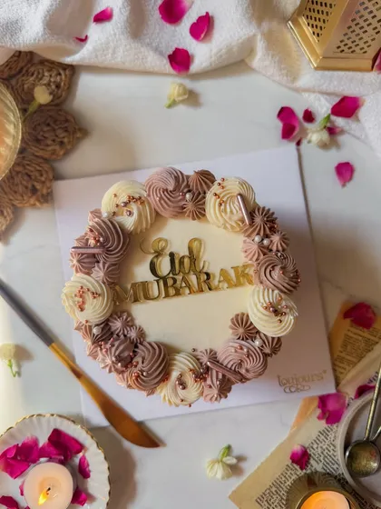 Our elegant Eid Mubarak cake, with beautifully piped buttercream swirls and a golden "Eid Mubarak" topper. It's the perfect centerpiece for your family's Eid celebrations.