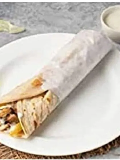 A simple, neatly wrapped shawarma roll shown on a plate, showcasing how I prepare it for delivery across JP Nagar and nearby areas.