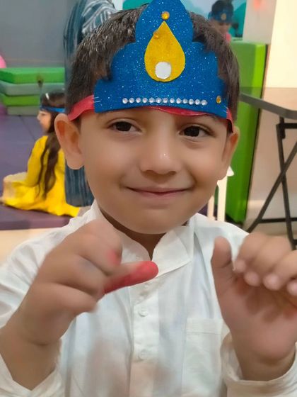 A happy little Krishna enjoying the Janmashtami festivities at our center. These celebrations are a wonderful way for kids to learn about Indian traditions.