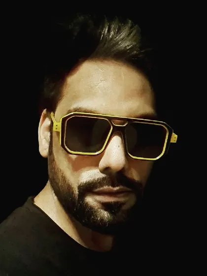 I could've smiled, but then I wouldn't look like the stereotypical serious music guy. A portrait that captures my brand's vibe, complete with the yellow shades.