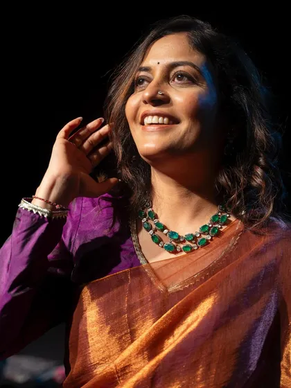 For singer Amruta Kolatkar's YouTube shoot, I chose a metallic bronze saree paired with a purple blouse and a statement green necklace. A bold and unconventional color combination.