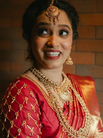 Her expressive eyes and bright smile say it all. The makeup is there to enhance, not overshadow, her natural beauty and happiness.