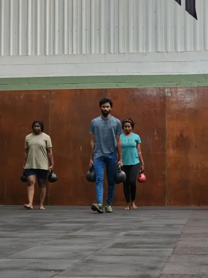 A group of members of all levels working through a kettlebell carry. We scale the weight for each individual, ensuring everyone gets a challenging and effective workout.