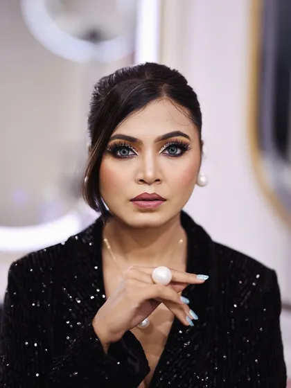 Beyond bridal, I create glamorous looks for any party or event. This look features a dramatic smokey eye with a flawless base, perfect for a cocktail party or reception. It’s all about making a statement and feeling confident.