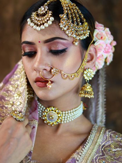 A close-up of this dramatic eye makeup, featuring a sharp wing and a pop of shimmer on the lid.