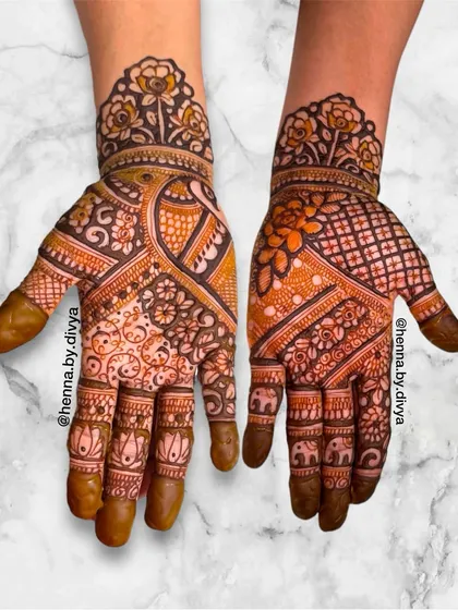 A rich and dense design combining florals, paisleys, and elephants. This full-hand pattern is perfect for a close family member who wants an elaborate and traditional look.