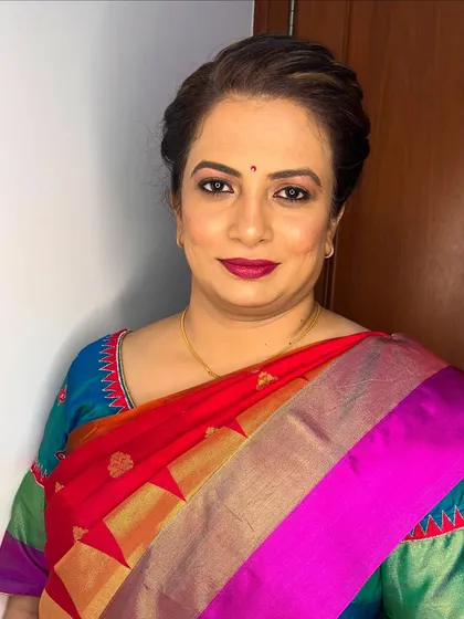 A straight-on view of the elegant makeup. The eyes are defined with liner and mascara, while the skin remains fresh and natural-looking.
