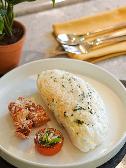 A closer look at our Fluffy White Omelette with Chia, Spinach & Parmesan. It’s a healthy, satisfying, and flavorful dish that we serve all day.