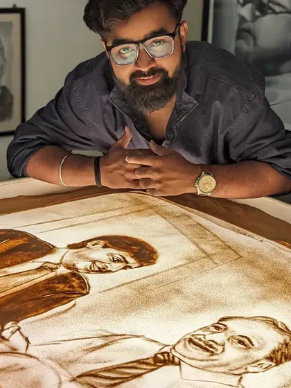 Another angle of my sand art tribute to Ratan Tata, showing the process of creating multiple scenes.